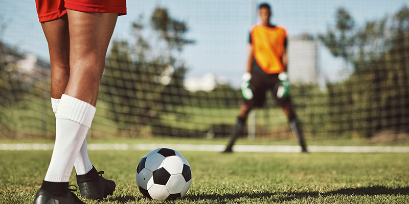 Footballer gets ready to shoot a penalty