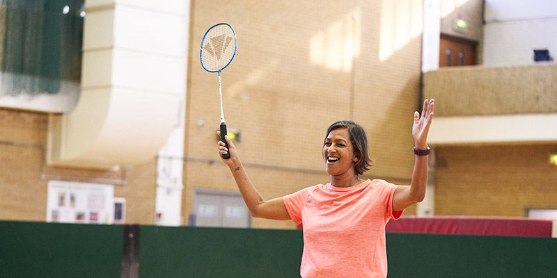 Woman celebrates playing badminton