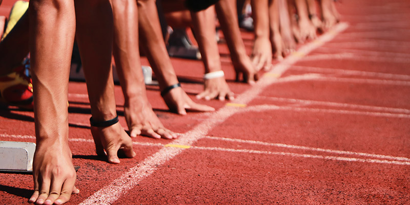 Cropped image of a sprinter getting ready to start at the stadium