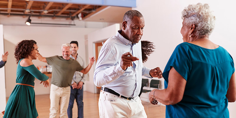 People Attending Dance Class In Community Center