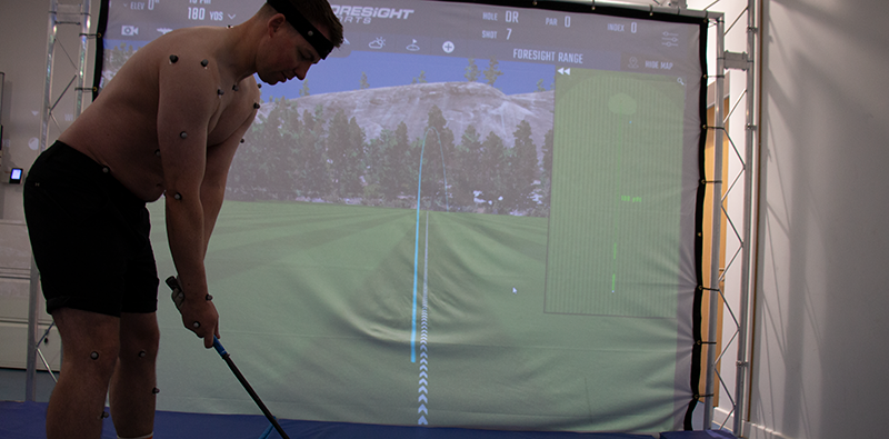 A golfer preparing to take a swing in a Loughborough University lab