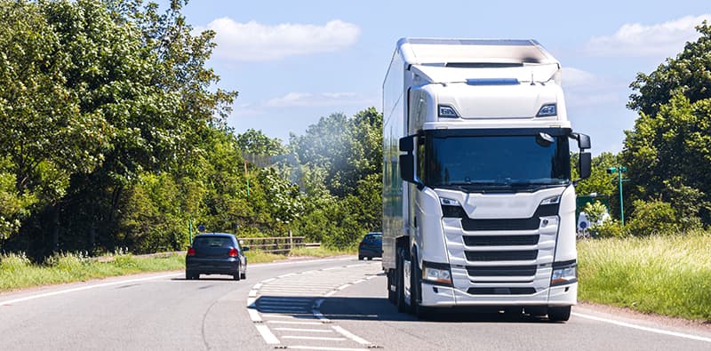 A truck driving along a country road